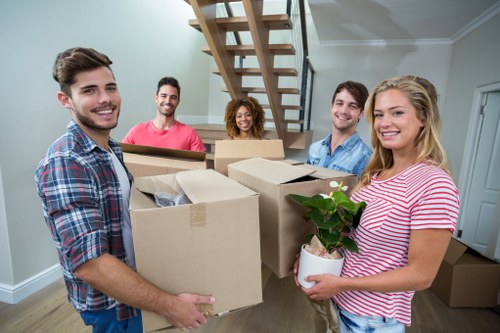 A professional moving van team planning a local move in South Kensington
