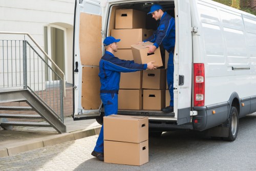 Team securing items in a van to prevent movement during transit