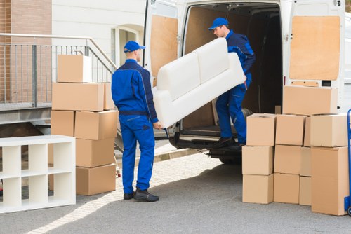 Local movers unloading furniture at a South Kensington property