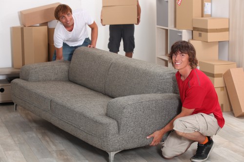 Local moving van loading boxes and furniture in South Kensington