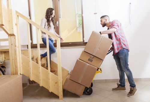 Team transporting items from a flat with stair access in South Kensington