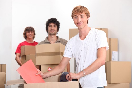Removal crew handling desks and equipment during a commercial move
